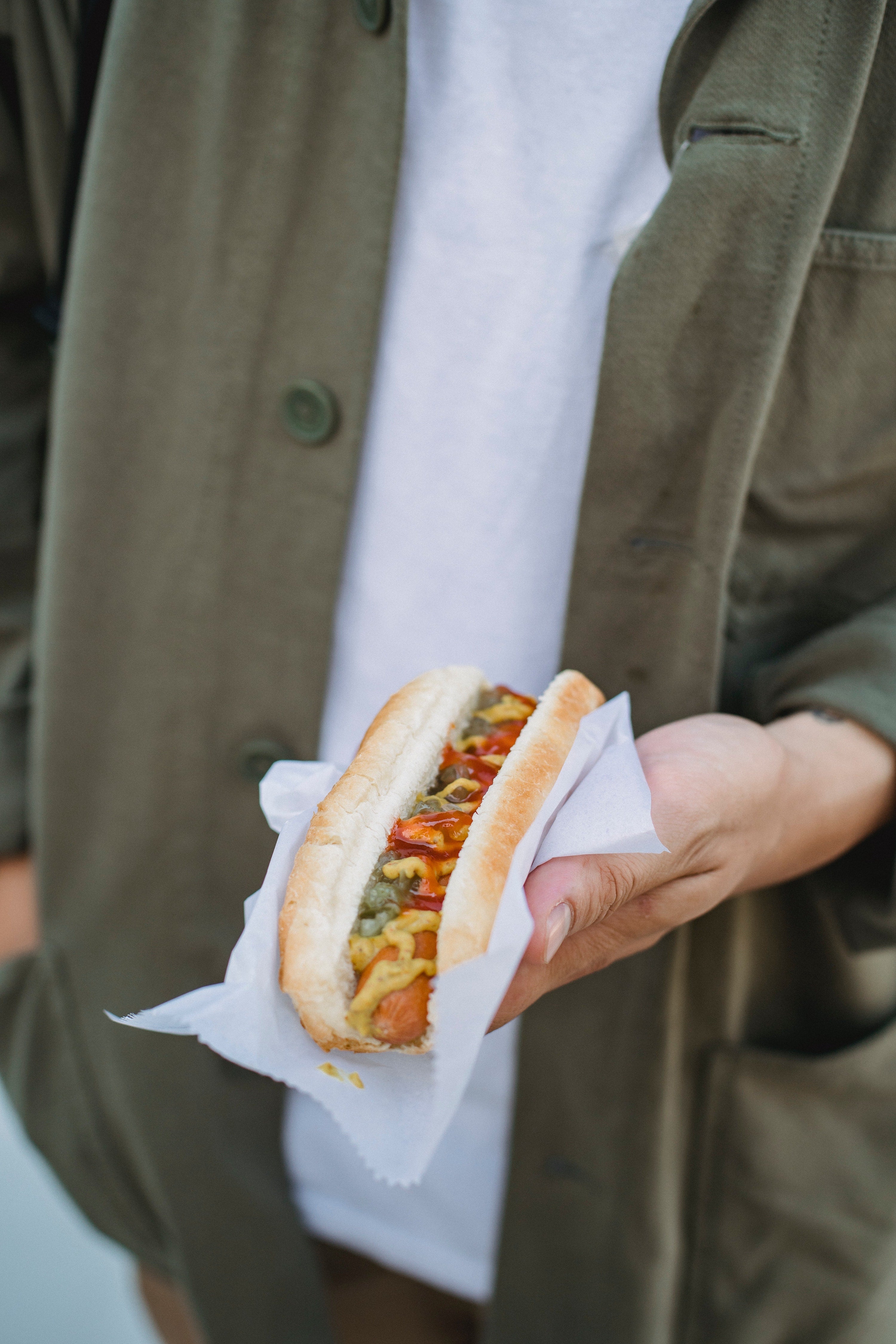 Person holding a hotdog