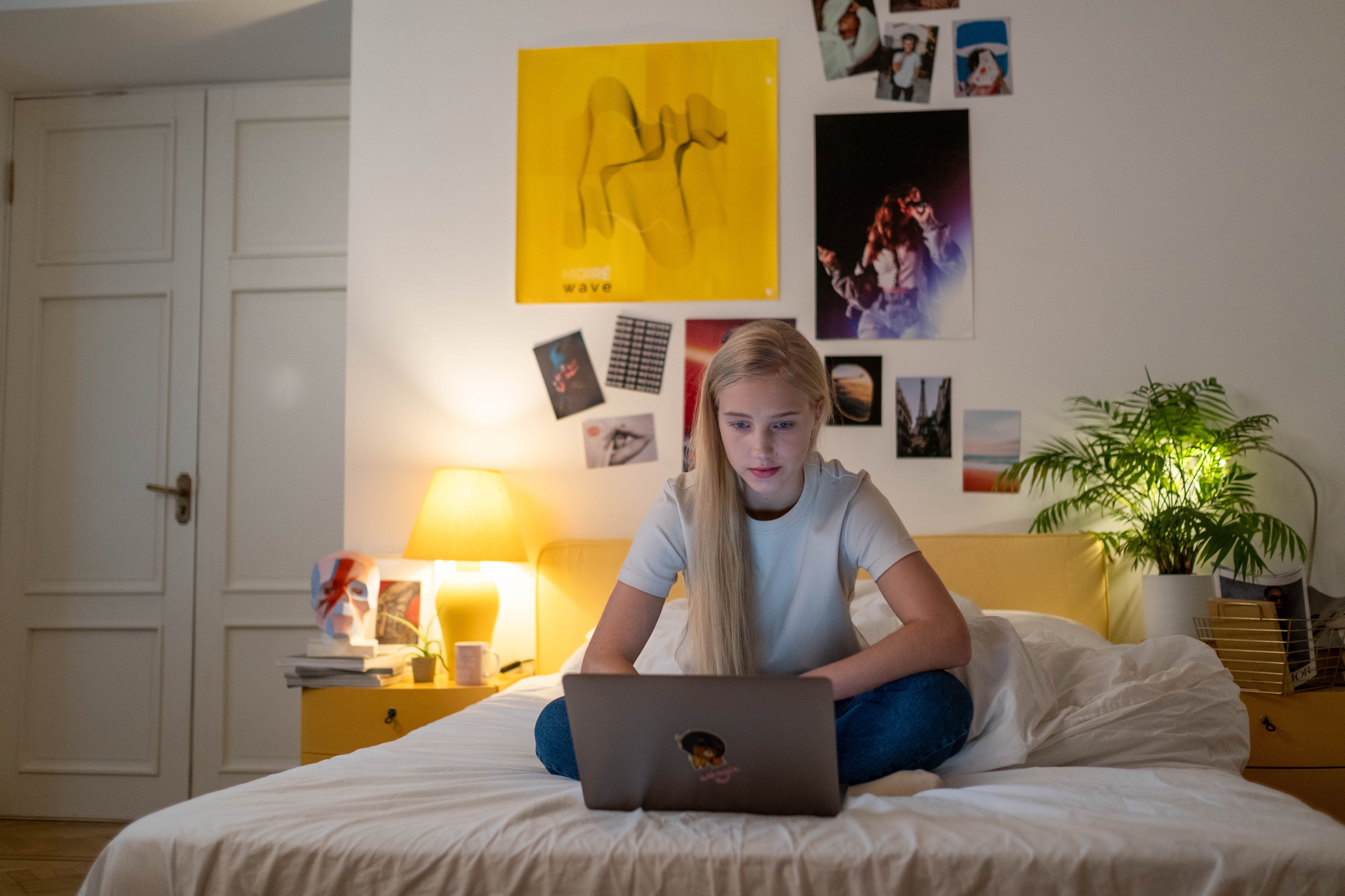 Studious teenager studying on laptop