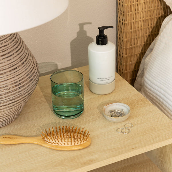 Probiotic Hand Lotion Bottle On Bed Side Counter