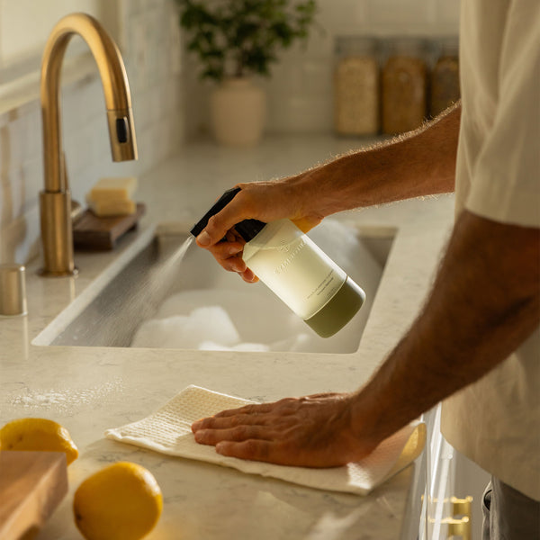 Multi-Purpose Cleaner Being Sprayed on Counter to Clean