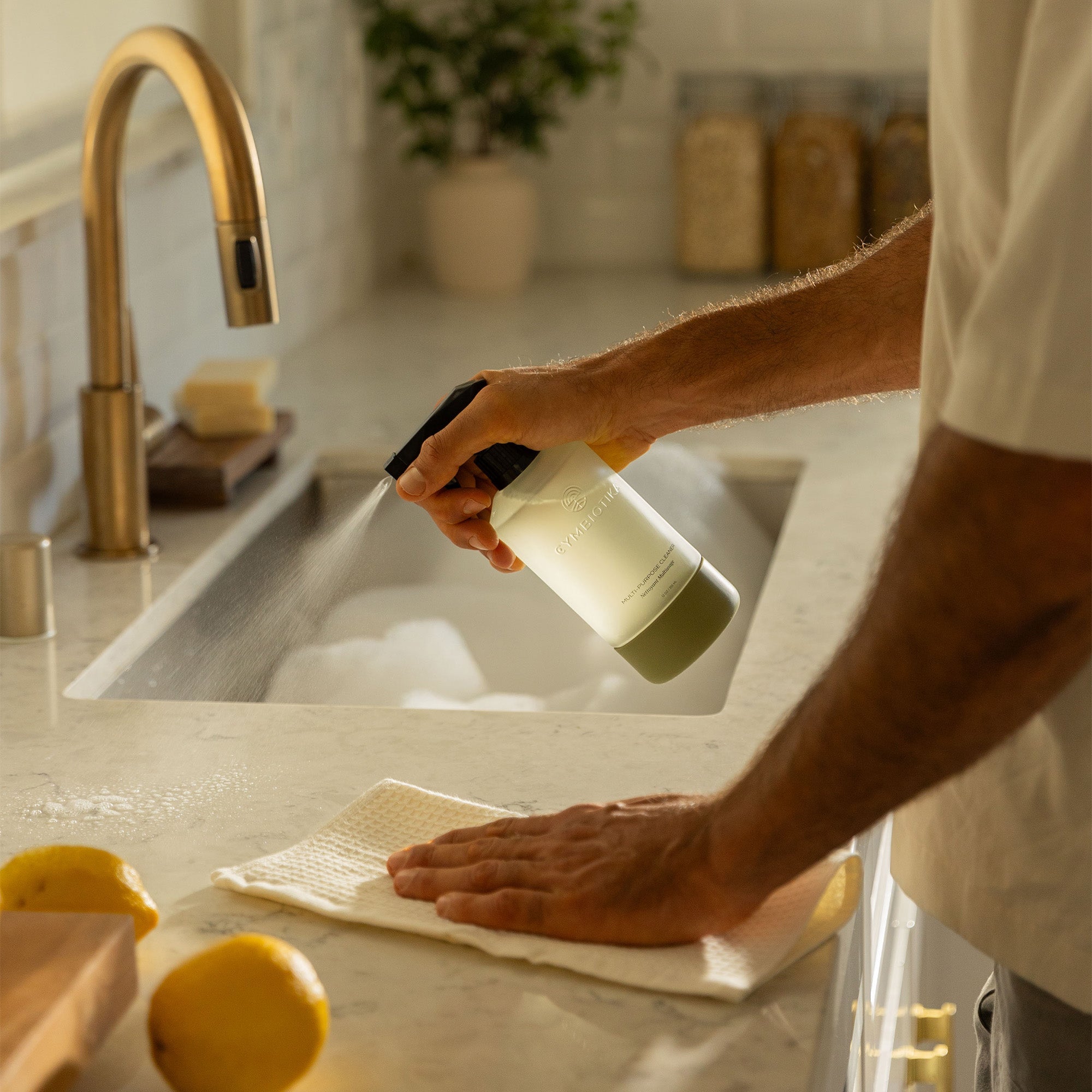 Multi-Purpose Cleaner Bottle being Sprayed onto Counter