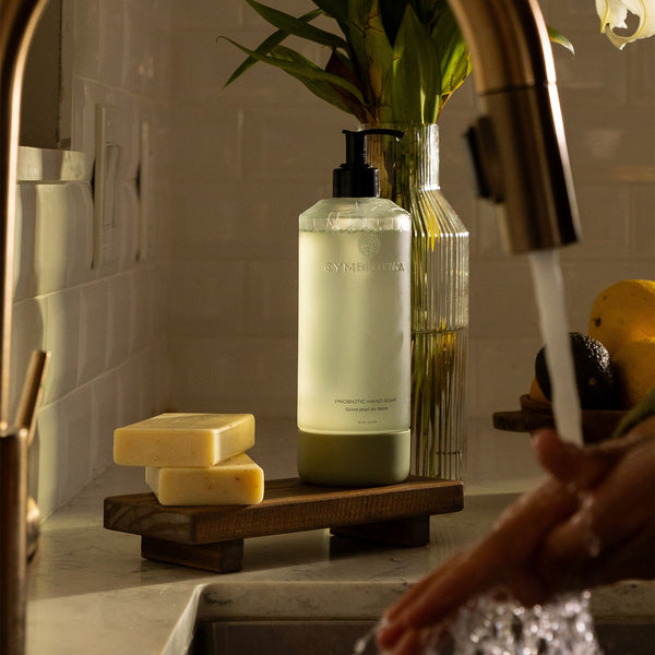 Probiotic Hand Soap Bottle next to Hand Soap Bars 